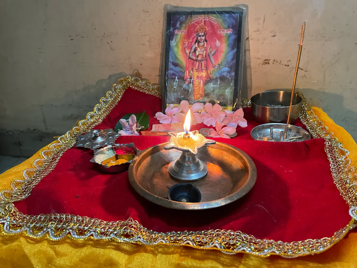 Dhanvantari puja on Dhanteras with offerings and a lamp