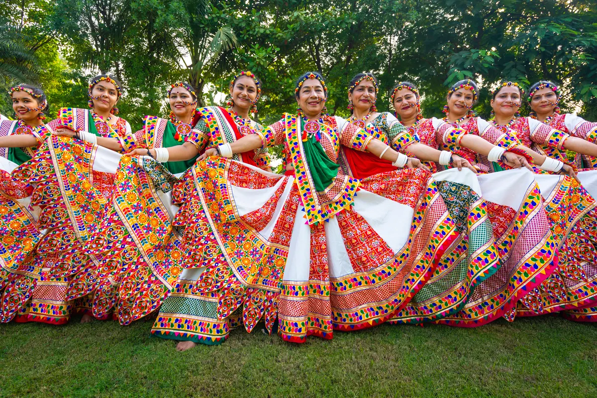 Garba dancers in bright coloured outfits at a Navratri celebration