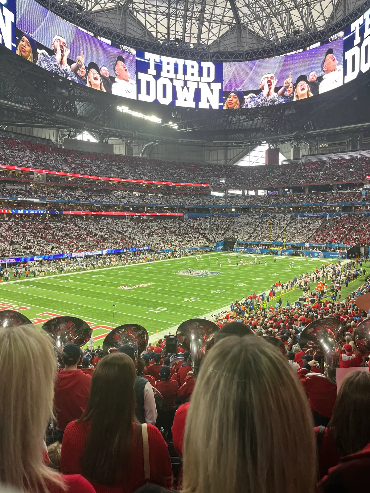Packed stadium under the roof during an American football game