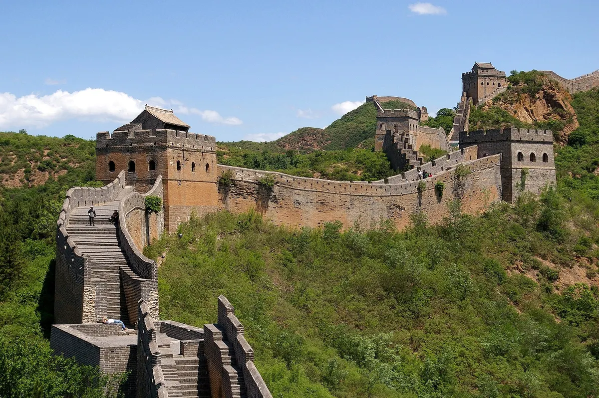 Watchtowers along the Great Wall of China on green summer hills