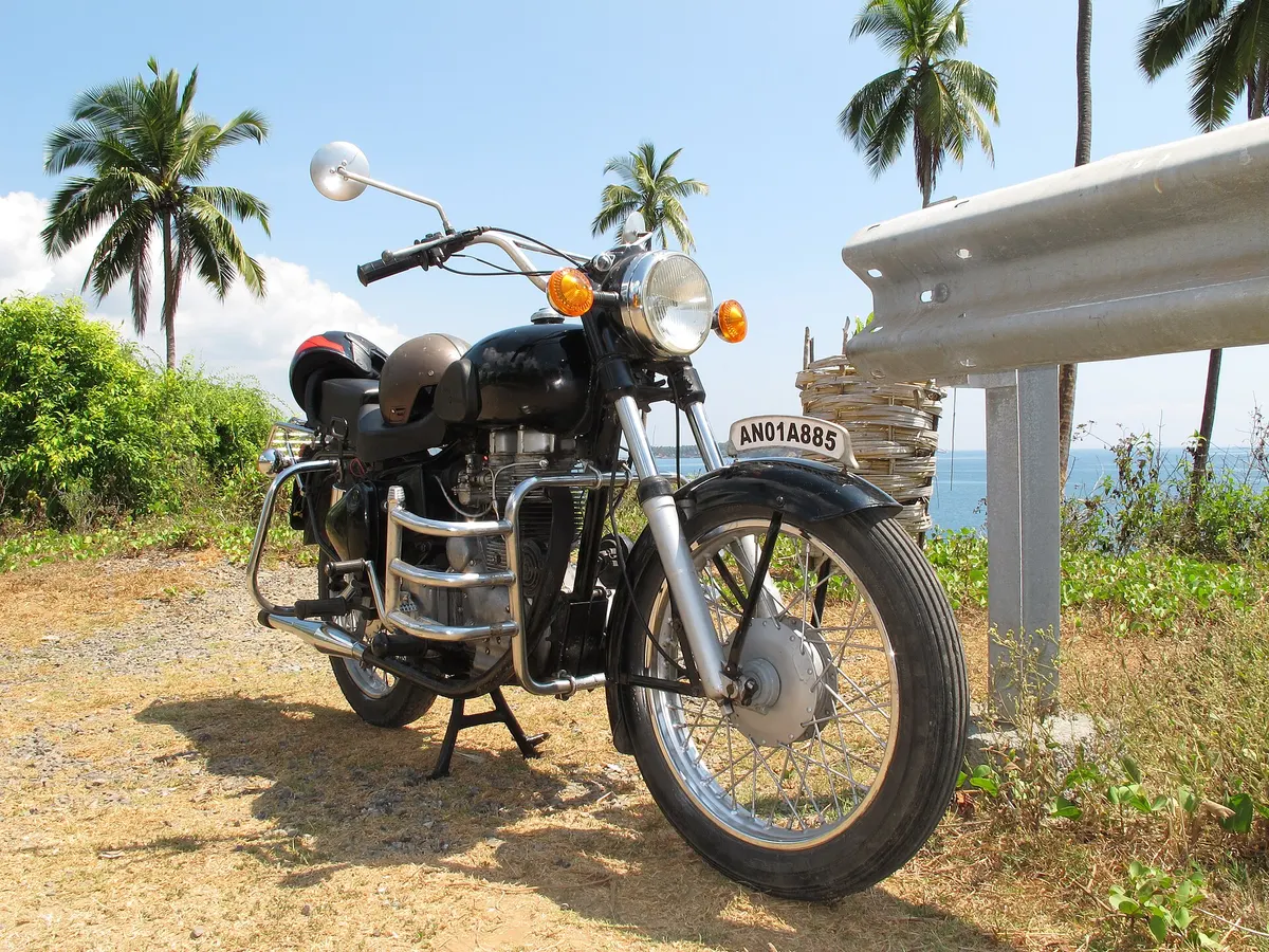Royal Enfield motorcycle parked by the sea