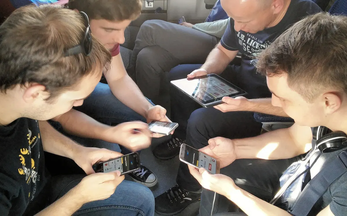 Friends playing a multiplayer mobile game together
