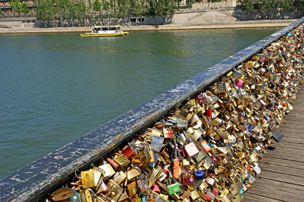 Thousands of love padlocks on the railing of the Pont des Arts bridge in Paris