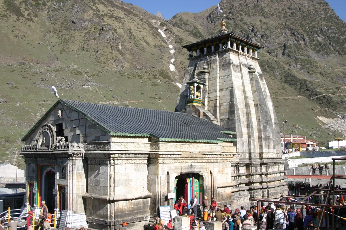 Kedarnath Temple in Uttarakhand with green Himalayan slopes behind it