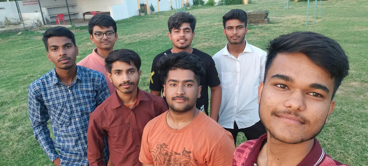 Group of young friends posing together in a park
