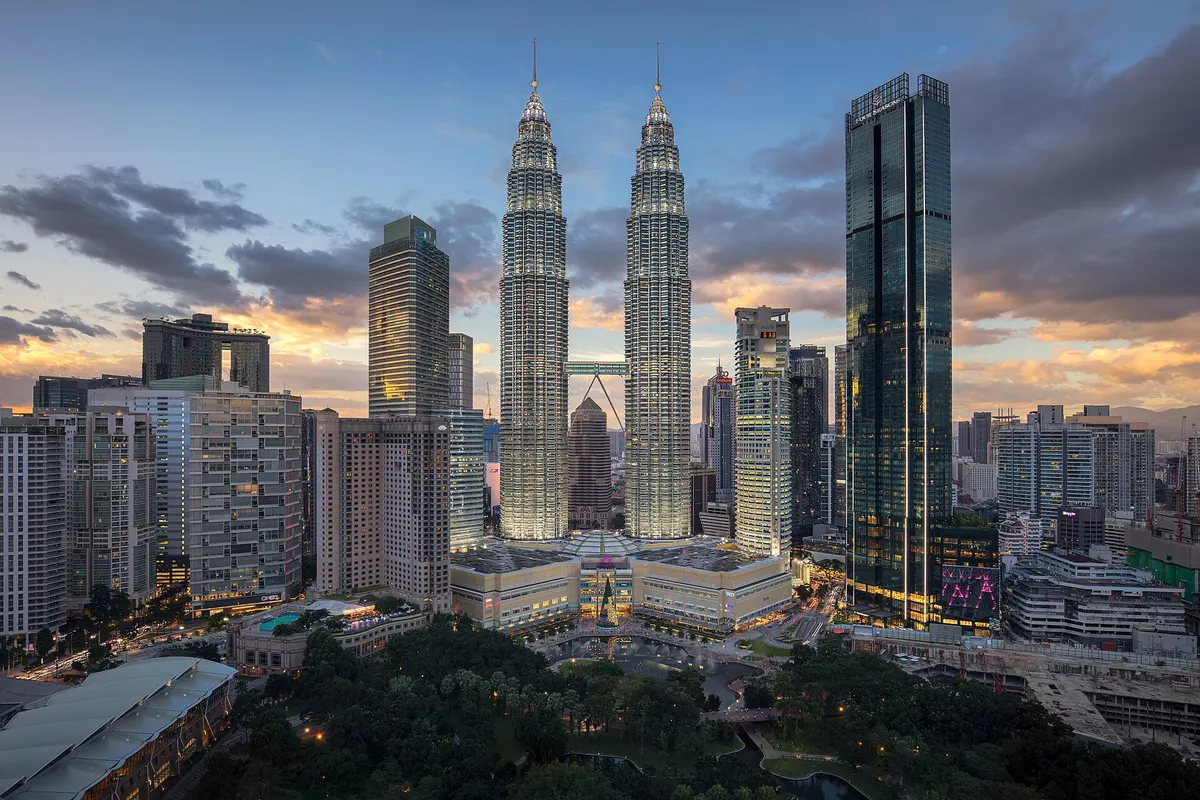 Petronas Twin Towers and the Kuala Lumpur skyline at dusk